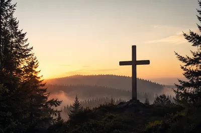 Wooden Cross Silhouette on Evergreen Sunrise Ridge