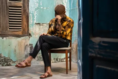 Anonymous Street Style Portrait in Teal Courtyard