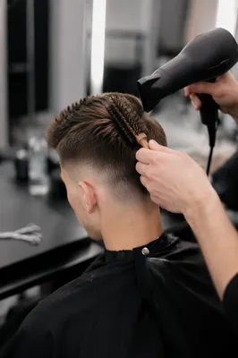 Professional Fade Haircut Styling in Modern Salon