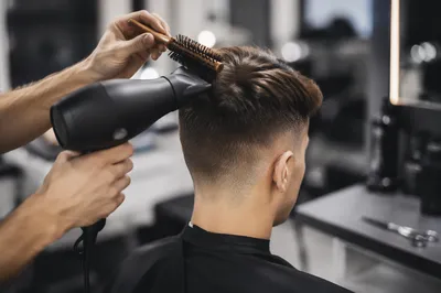 Professional Fade Haircut Styling in Modern Salon