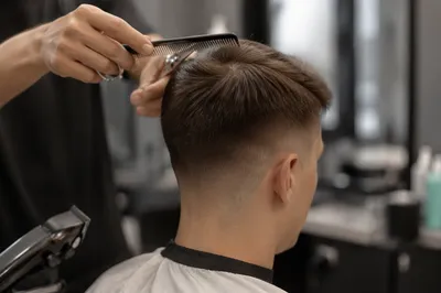 Close-Up Taper Fade Haircut in Modern Salon