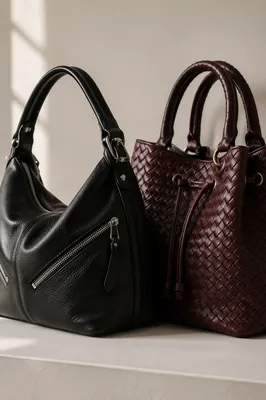 Luxury Leather Handbags on Cream Boutique Table