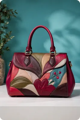 Luxury Patterned Leather Handbag on Teal Backdrop