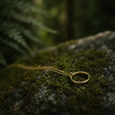 Elegant Gold Ring Necklace on Woodland Moss