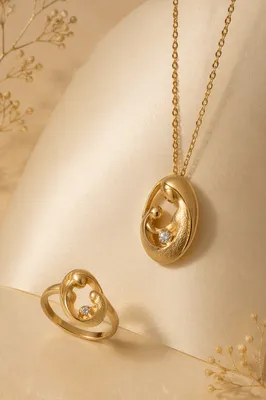 Elegant Gold Necklace and Ring Still Life