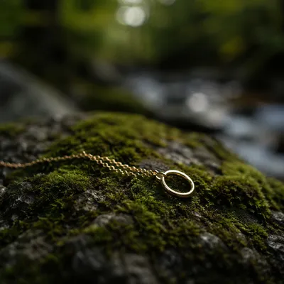 Elegant Gold Ring Necklace on Moss