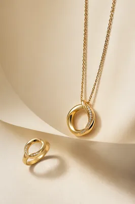 Elegant Gold Necklace and Ring Still Life