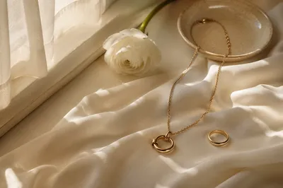 Elegant Gold Jewelry on Ivory Silk