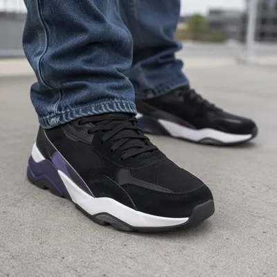 Black Fashion Sneakers on Gray Sidewalk