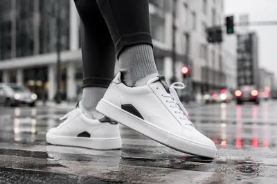 White Sneakers on Rainy City Crosswalk