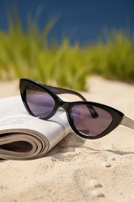Black Cat Eye Sunglasses on Beach Sand