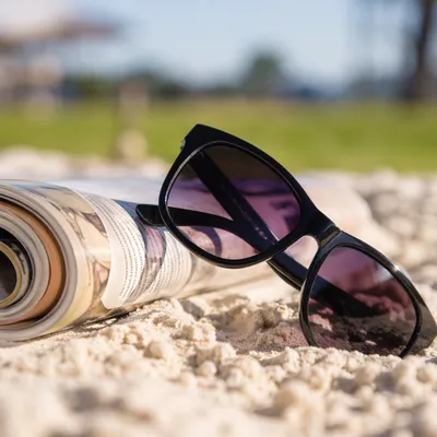 Black Sunglasses on Summer Beach Sand