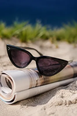 Black Cat Eye Sunglasses on Beach Sand