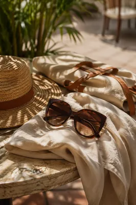 Oversized Sunglasses on Sunlit Summer Terrace