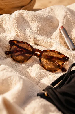 Tortoiseshell Sunglasses on Ivory Beach Towel