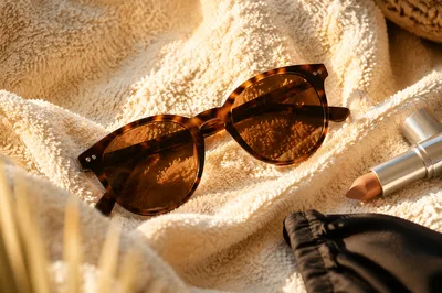 Tortoiseshell Sunglasses on Ivory Beach Towel
