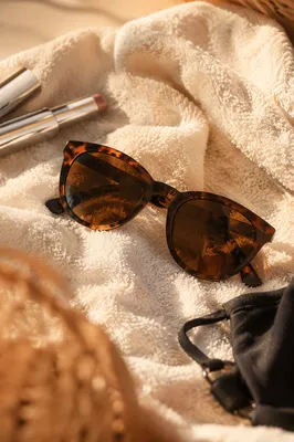 Tortoiseshell Sunglasses on Ivory Beach Towel