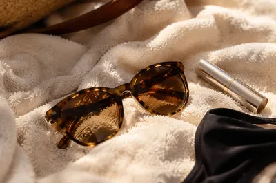 Tortoiseshell Sunglasses on Ivory Beach Towel