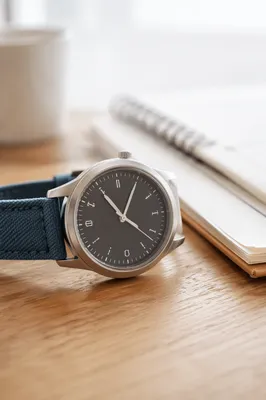 Close-Up Wristwatch on Wooden Desk