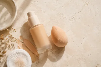 Foundation Bottle and Beauty Blender Flat Lay