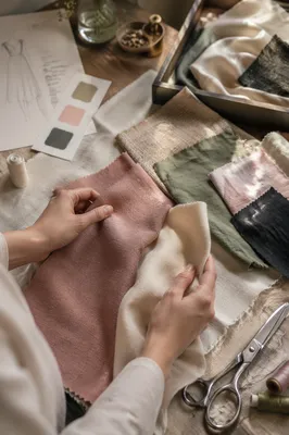Fashion Designer Comparing Fabric Swatches