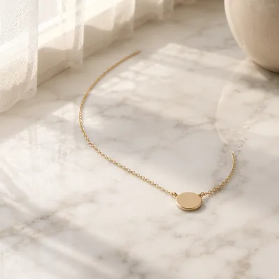 Elegant Gold Necklace on White Marble