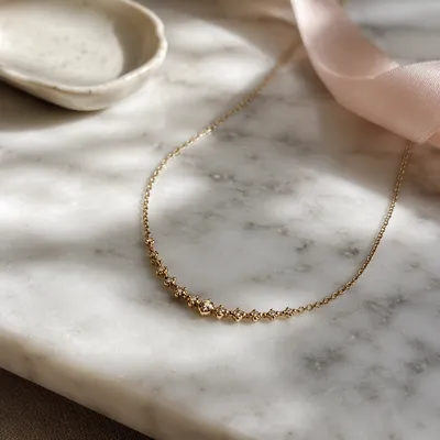 Elegant Gold Necklace on White Marble