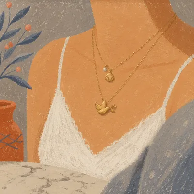 Layered Gold Necklace on Marble Vanity