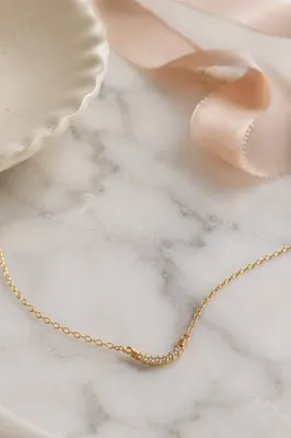 Elegant Gold Necklace on White Marble
