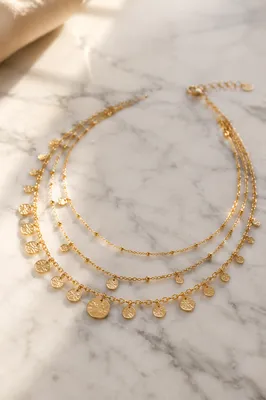 Elegant Gold Necklace on White Marble