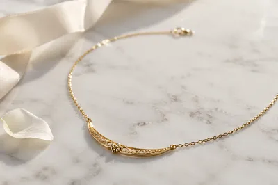 Elegant Gold Necklace on White Marble
