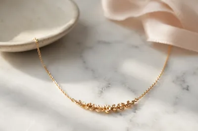 Elegant Gold Necklace on White Marble
