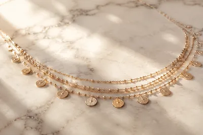 Elegant Gold Necklace on White Marble