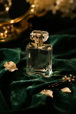 Elegant Perfume Bottle on Emerald Velvet