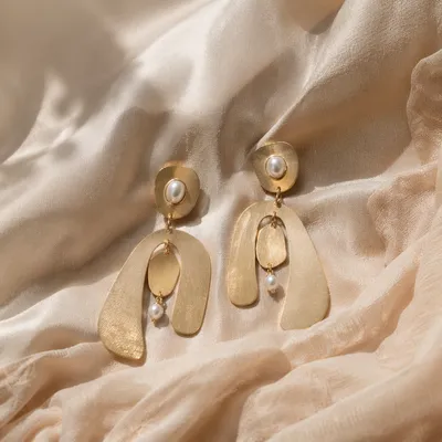 Elegant Statement Earrings on Draped Fabric