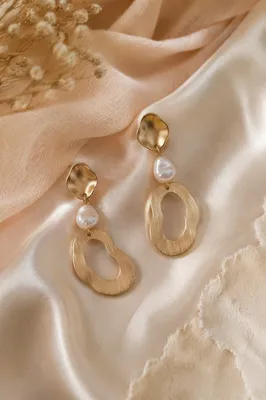 Elegant Statement Earrings on Draped Fabric
