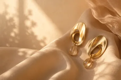 Elegant Statement Earrings on Silk Drapery