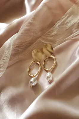Elegant Statement Earrings on Satin Backdrop