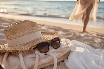 Elegant Straw Hat and Sunglasses by Shore