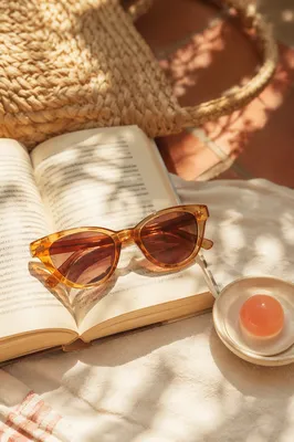Vintage Cat-Eye Sunglasses on Open Book