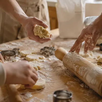 Hands Preparing Cookie Dough in Kitchen