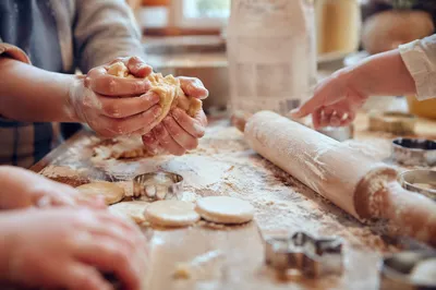 Hands Preparing Cookie Dough in Kitchen