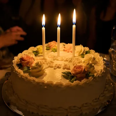 Candlelit Birthday Cake in Intimate Celebration
