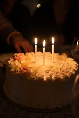 Candlelit Birthday Cake in Intimate Celebration
