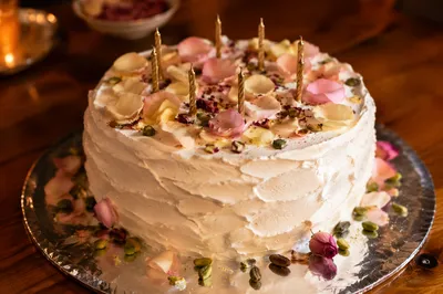 Rustic Birthday Cake with Petals and Candles