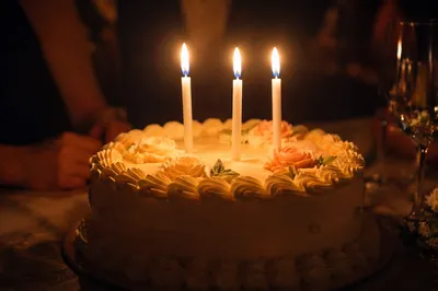 Candlelit Birthday Cake in Intimate Celebration