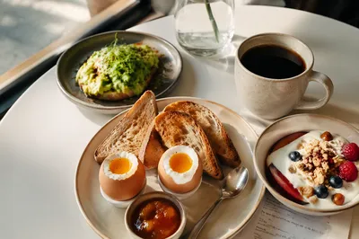 Bright Cafe Breakfast Spread with Avocado Toast