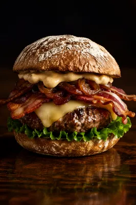 Gourmet Burger Close-Up on Dark Wood