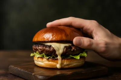 Gourmet Burger Close-Up on Wooden Board