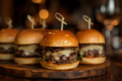 Gourmet Mini Burgers on Wooden Board